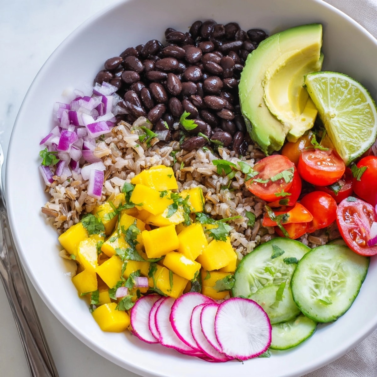 Close-up of vibrant Mango Salsa Black Bean Bowls, ready to eat, a healthy, colorful meal.