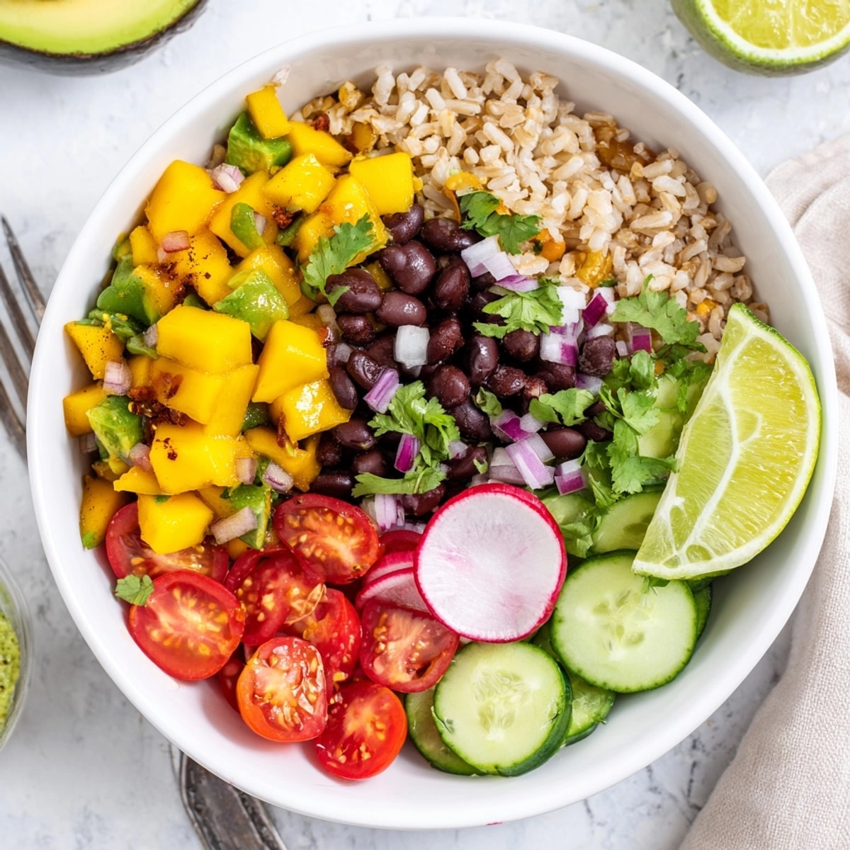 A beautifully layered Mango Salsa Black Bean Bowl showcasing fresh ingredients and vibrant, summery flavors.