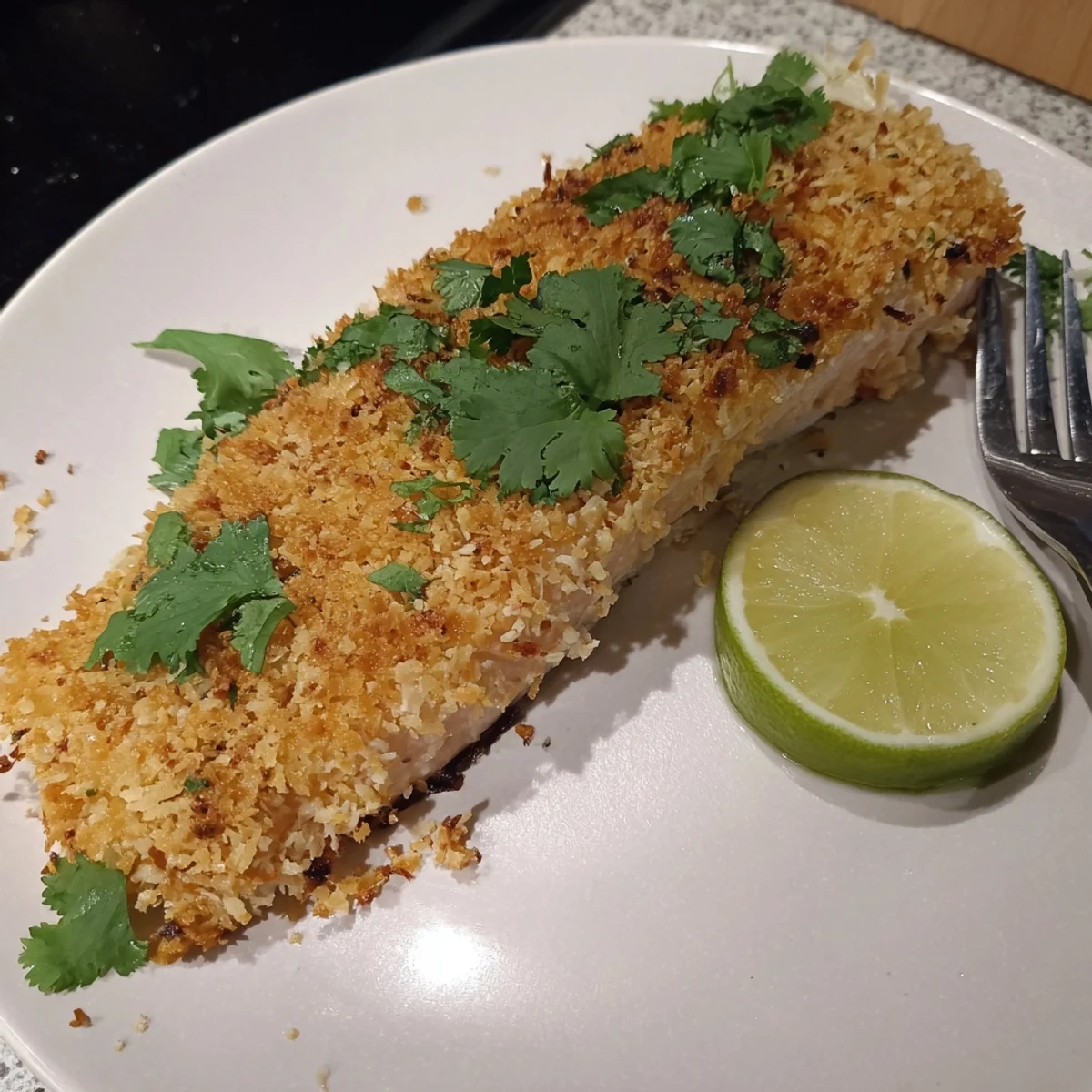 Crispy coconut crusted salmon fillets, golden brown with a tropical twist, ready to serve.