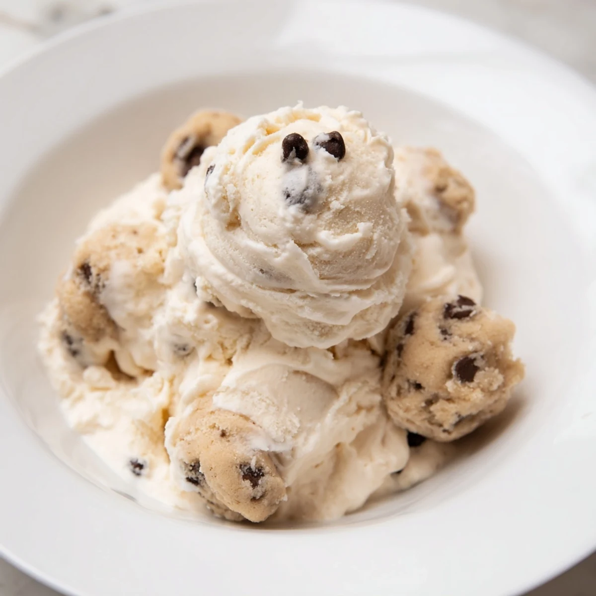 Guilt-free cottage cheese ice cream topped with delightful, chewy cookie dough clusters.  