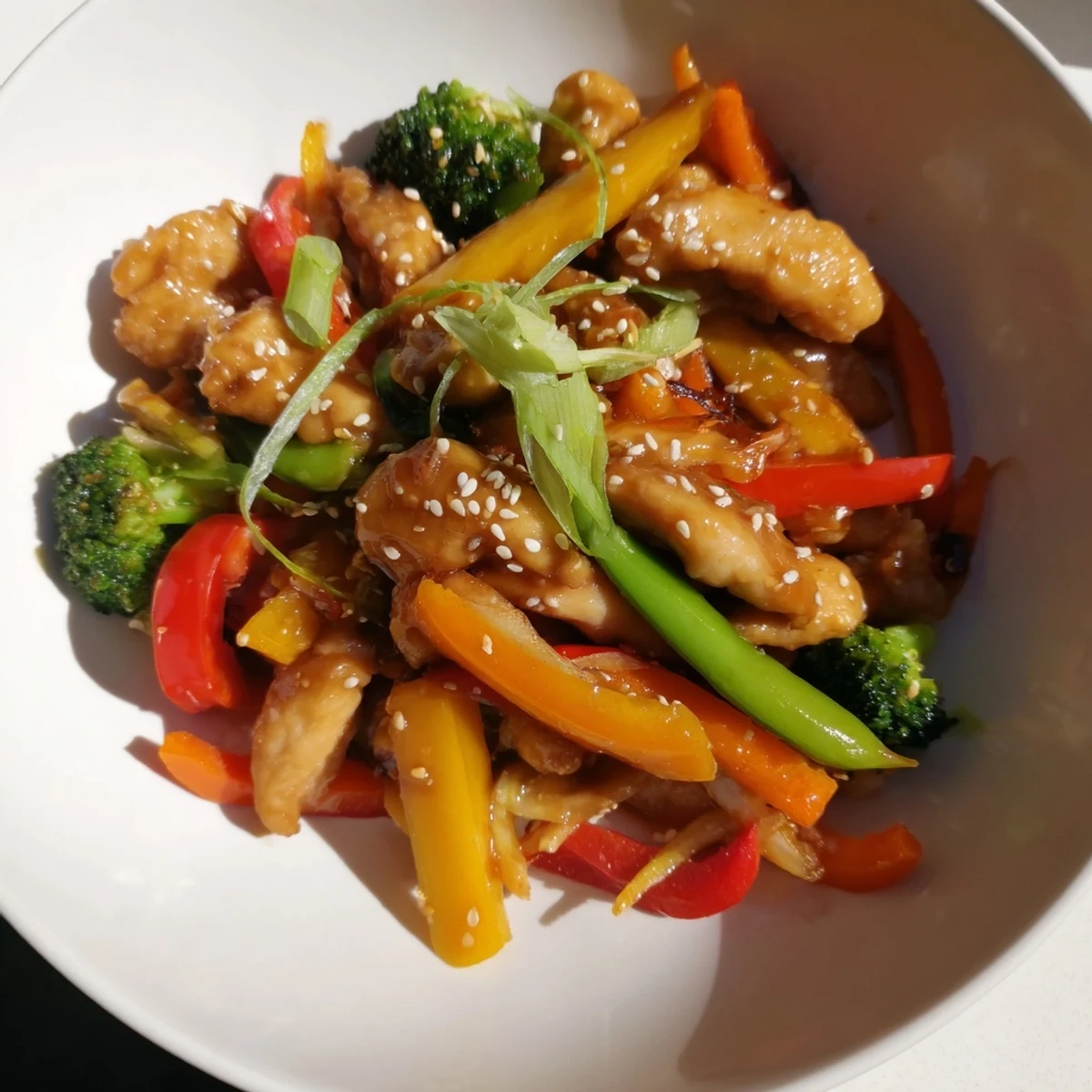 Imagine a flavorful chicken stir-fry; a quick meal with vegetables atop a bed of rice.