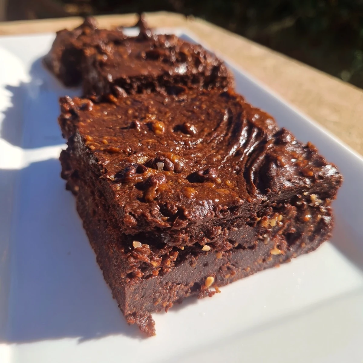 A close-up of deeply chocolatey Pumpkin Workout Brownies, perfect for a healthy dessert.
