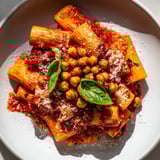 Savory Spicy Arrabbiata Roasted Chickpea Crunch Pasta with crispy chickpeas and fresh basil garnish for dinner.