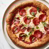 Savory ground beef pizza base with bubbly mozzarella, promising a delicious, gluten-free dinner.