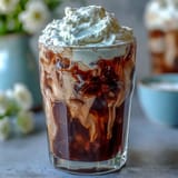 Rich cold brew coffee, artfully topped with homemade vanilla sweet cream, perfect for brunch.