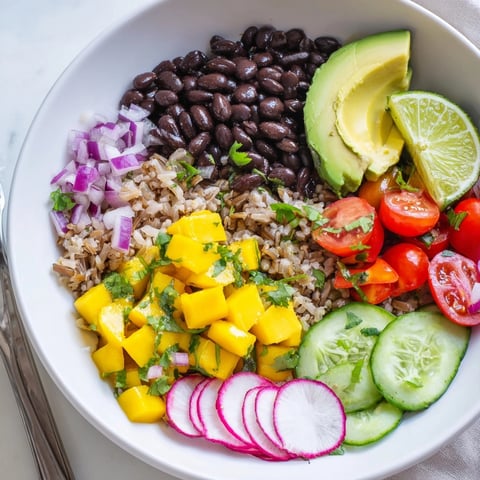 Close-up of vibrant Mango Salsa Black Bean Bowls, ready to eat, a healthy, colorful meal.