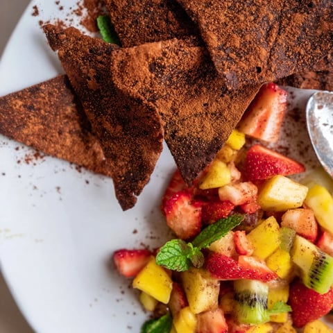 Crispy chocolate tortilla chips served with vibrant fruit salsa for dipping.  