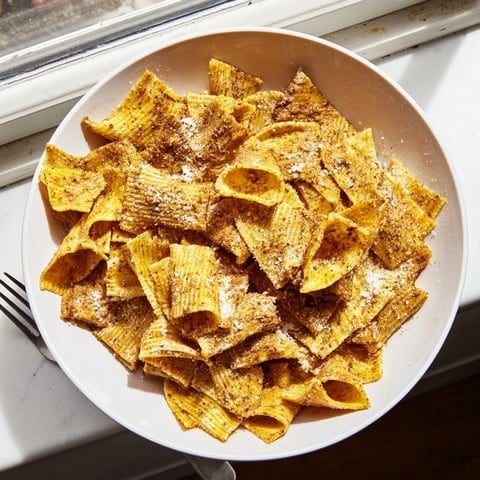 Crispy pasta chips seasoned variety served with zesty marinara sauce for dipping.  