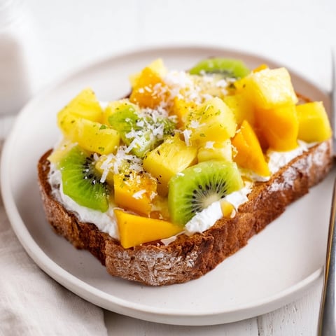 Delicious Yogurt-Custard Toast 2.0 topped with tropical fruits and shredded coconut.  
