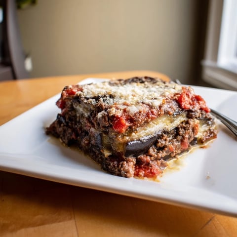 Golden-brown layers of delicious moussaka with beef and eggplant, baked to bubbly perfection.