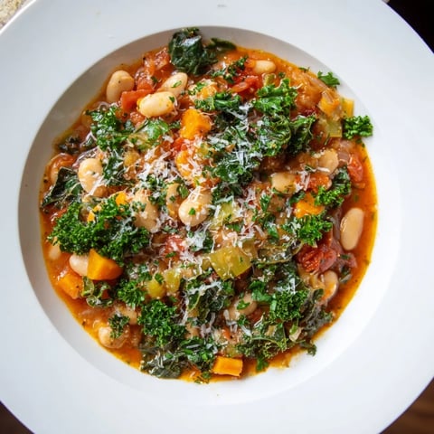 Steaming Italian Bean & Kale Stew, a vibrant medley of vegetables with a savory broth.