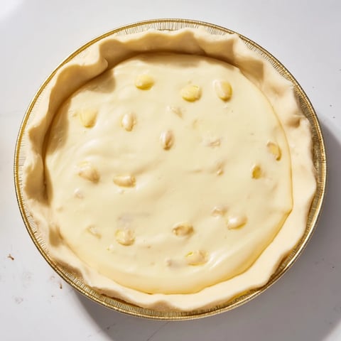 A golden, baked Water Pie with a crimped crust, ready for a comforting slice of homemade dessert.
