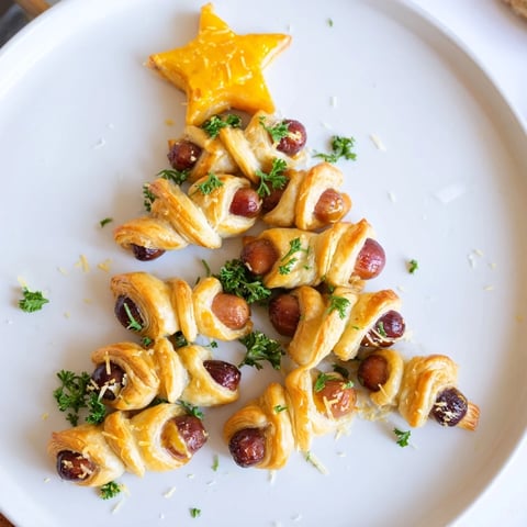 Golden brown Express Pigs in Blanket Christmas Tree, ready to serve with mustard dipping sauce.