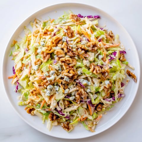 Fresh Crunchy Apple & Walnut Slaw: bright apples, walnuts, and blue cheese ready to serve as a side.