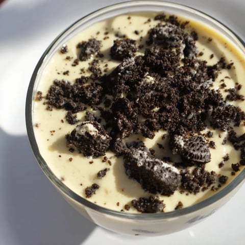 Creamy vanilla pudding with a generous layer of crushed Oreos, a classic dessert.