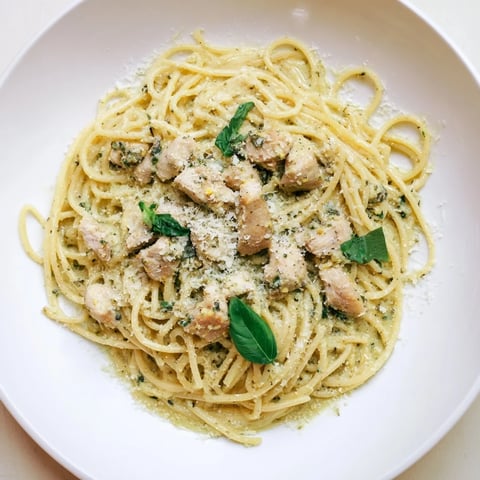 Creamy pesto egg and chicken pasta topped with Parmesan; a delicious, satisfying family dinner.