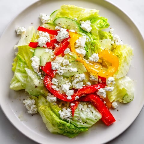 Vibrant Bella Hadid Salad featuring crisp romaine, colorful peppers, creamy feta, and zesty lemon dressing.