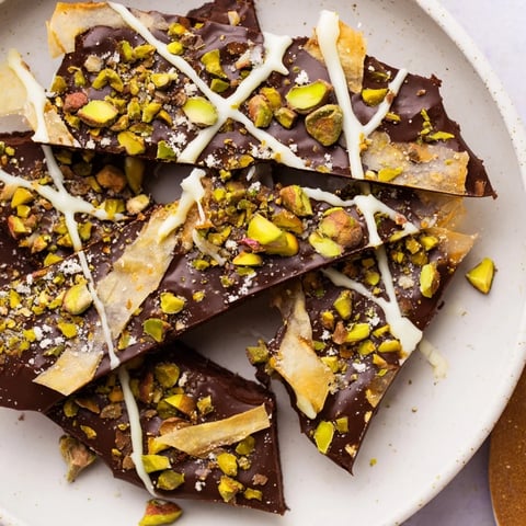 Glorious Pistachio Dubai Chocolate Bark with layers of chocolate and crunchy pistachios, ready to break and eat.