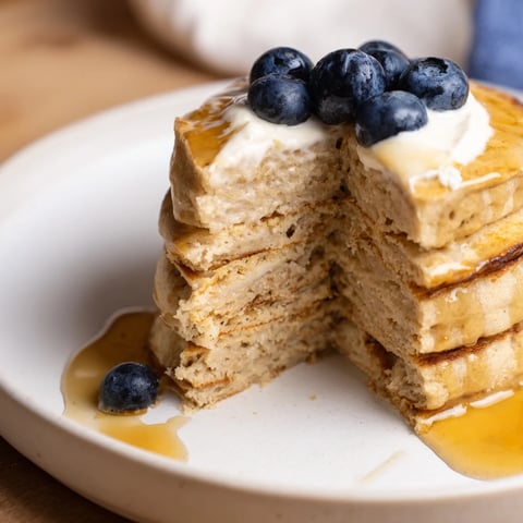Golden, fluffy cottage cheese pancakes stacked high, perfect for a hearty and protein-rich breakfast.