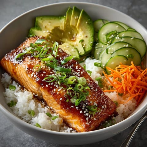 Honey Sriracha Glazed Salmon Bowls recipe: Up-close view—tender salmon chunks and vibrant veggies.