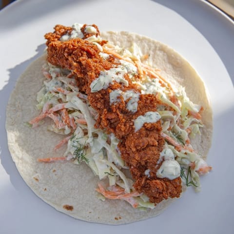 Get a taste of these delicious Buffalo Chicken Smash Burger Tacos, bursting with saucy, spicy chicken.