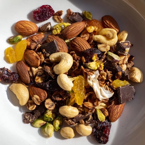 Golden raisins and chocolate chunks are scattered amidst the delicious Mountain High Adventure Snack Mix.