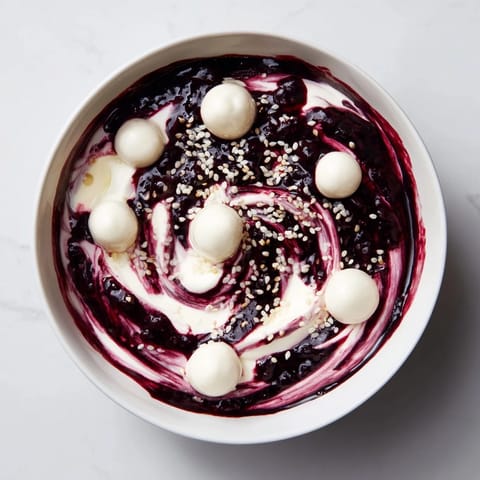 Picture this: The Galaxy Spiral, a vibrant dessert with goat cheese "stars" in a galaxy of berry swirls.