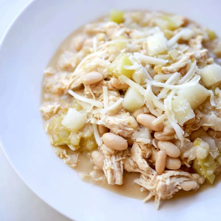 Close-up of a warm, rich 35-Minute White Cheddar Apple Chicken Chili, ideal for a chilly evening.