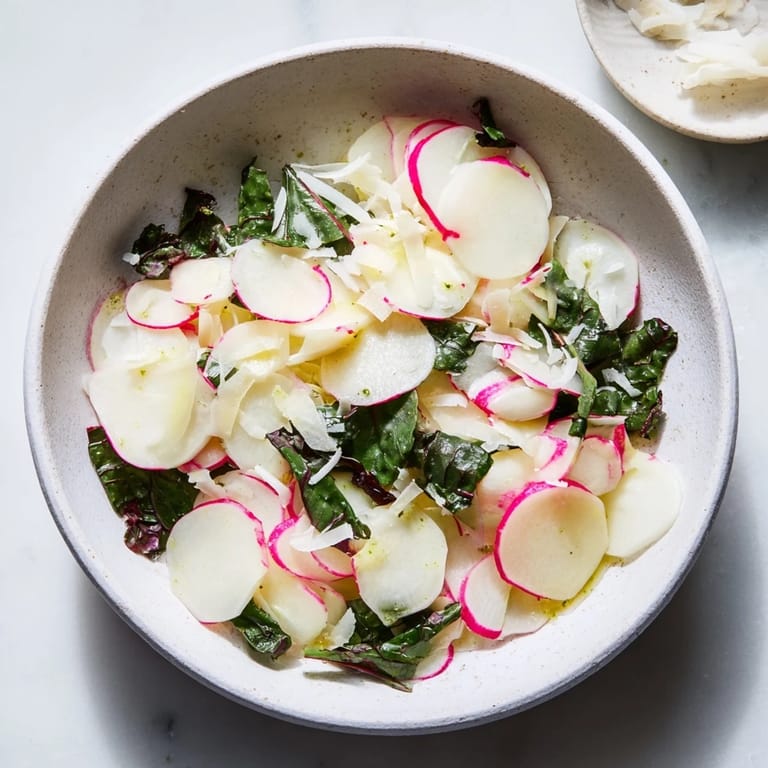 Artfully arranged Tundra Trek salad: a cold, refreshing dish with subtle flavors and fresh microgreens.