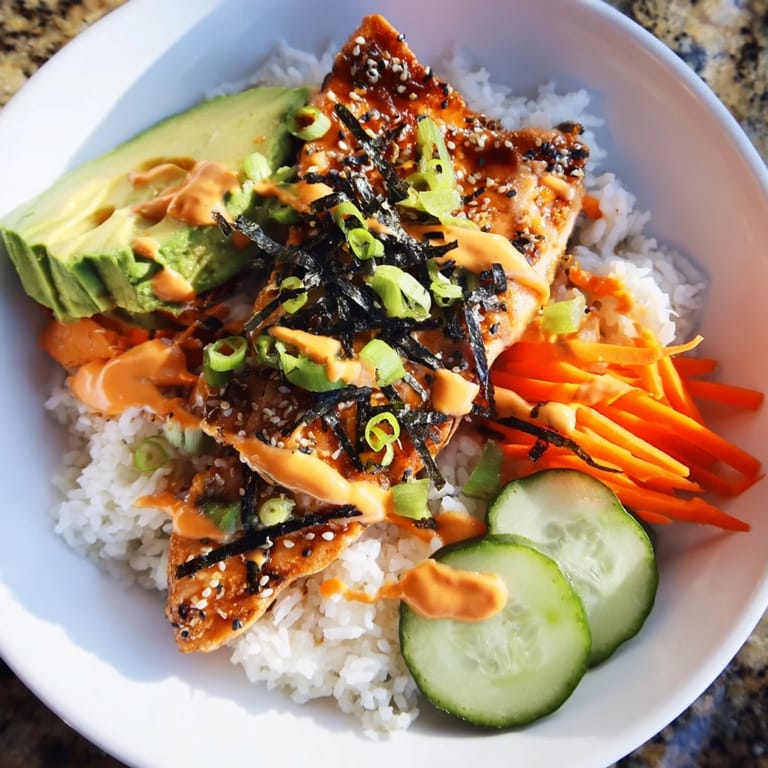 Perfectly cooked teriyaki salmon rice bowl, a harmonious blend of textures and Asian-inspired flavors, delicious!